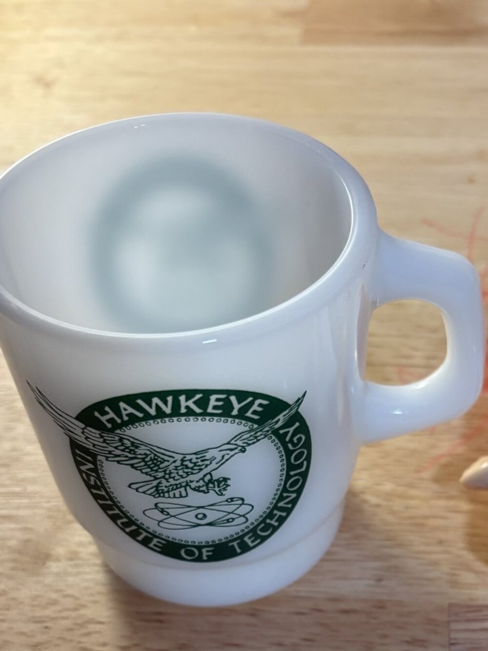 Hawkeye institute of technology coffee mug.